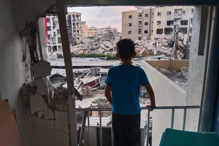 A Lebanese boy looks out of the window of a hospital in the south Lebanon city of Tyre that was destroyed by an Israeli strike, June 1 2026.