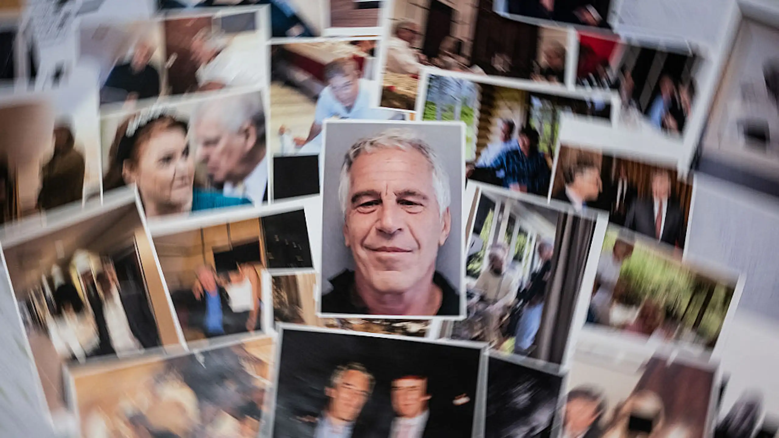 A blurred collection of undated pictures, provided by the U.S. Justice Department from its investigation of Jeffrey Epstein, form a collage behind Epstein's mug shot.