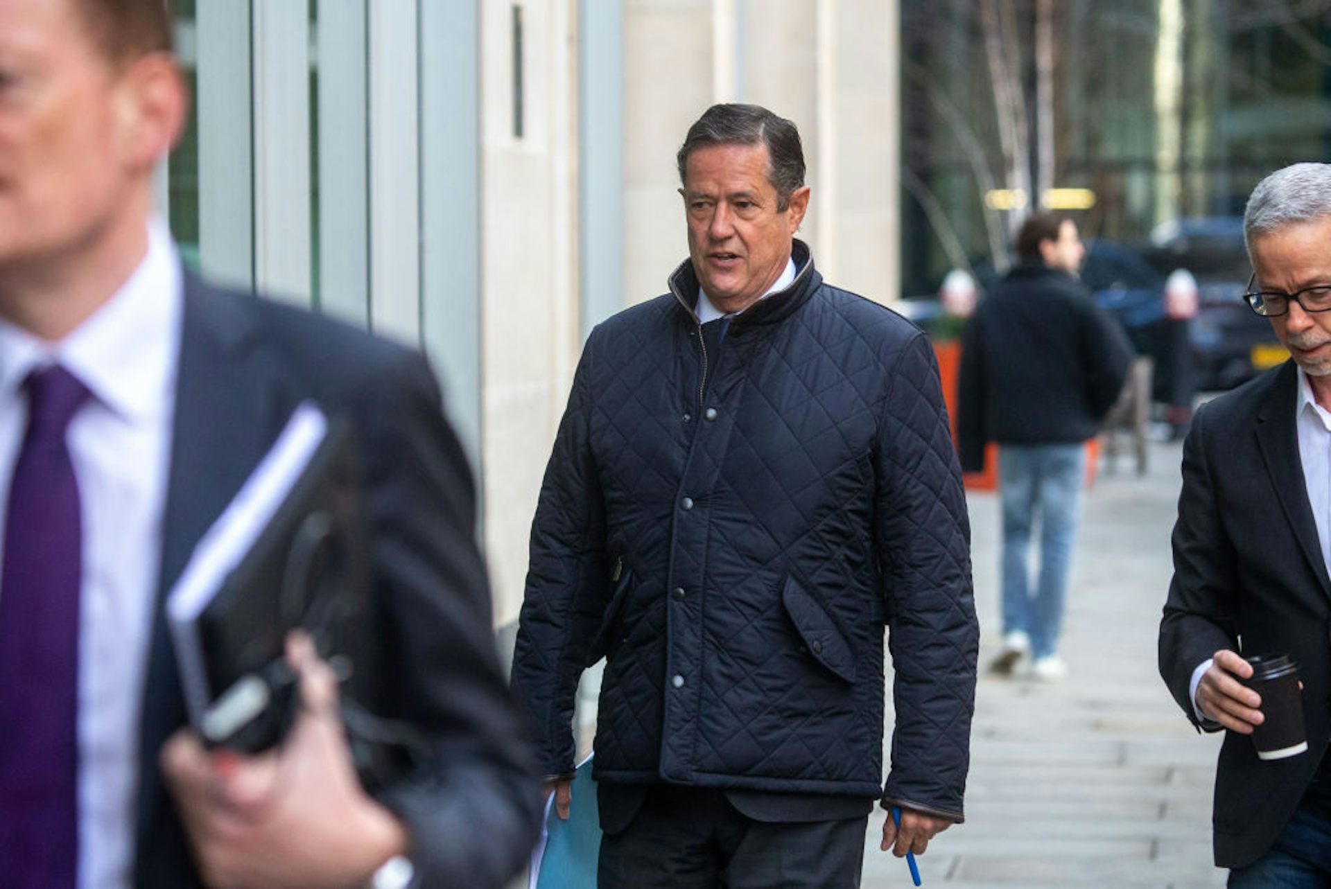 Former Barclays CEO Jes Staley, in a dark coat, arrives at the High Court in London, United Kingdom, on March 14, 2025, to challenge his ban from the UK finance sector.