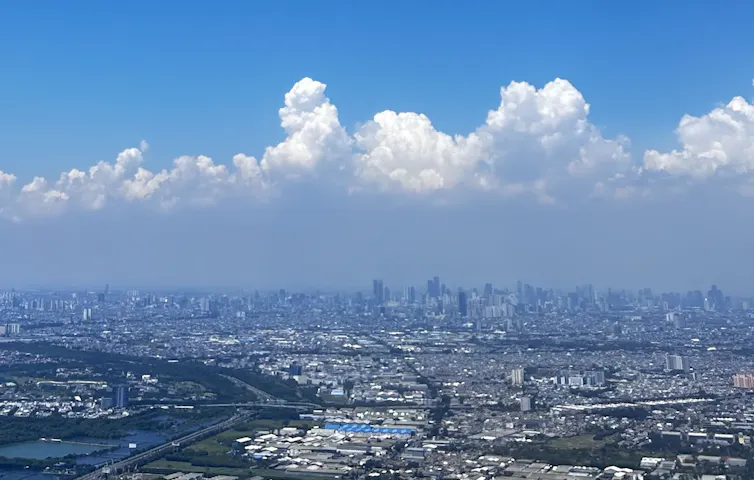 Air pollution haze covering Jakarta skyline.