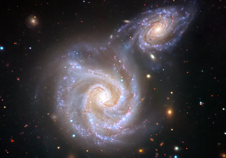 Artist's impression of the young Milky Way colliding with another galaxy around 10 billion years ago.