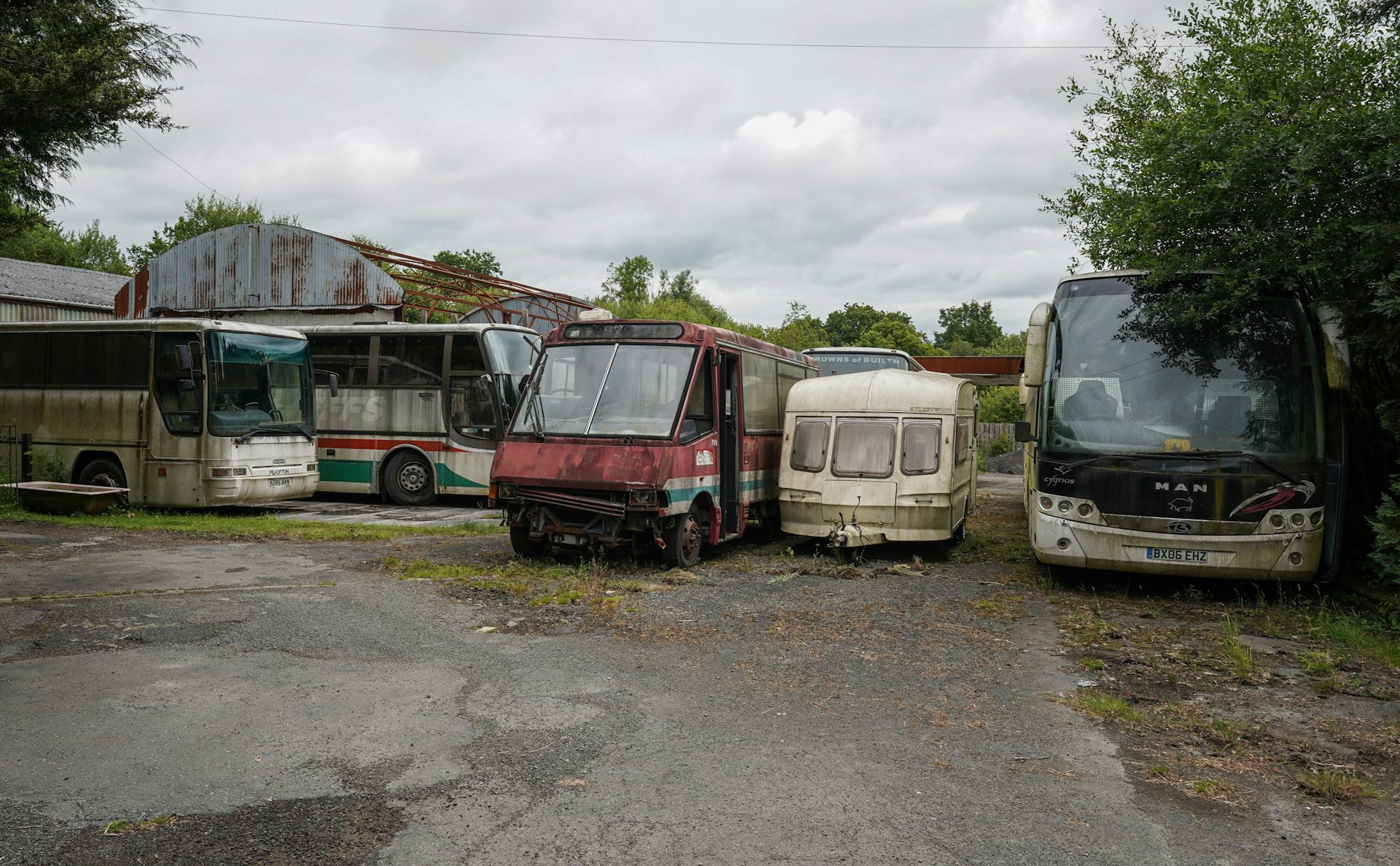 Abandoned buses at a petrol station in Wales