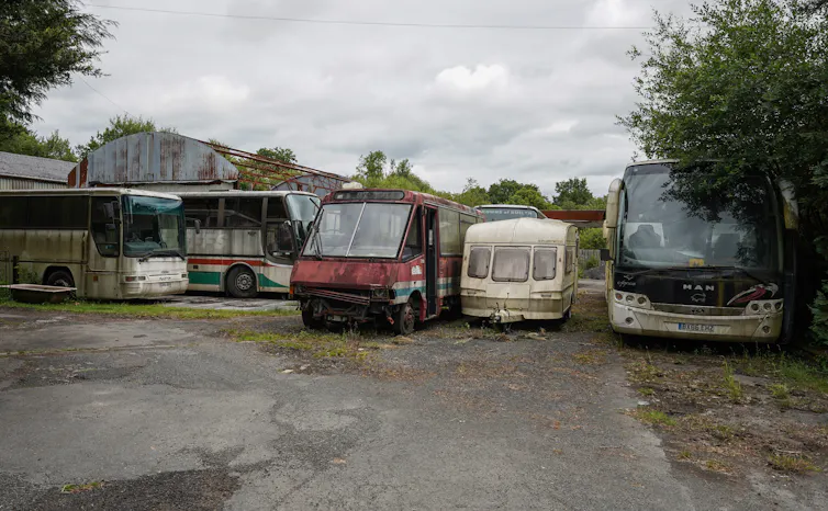 Abandoned buses at a petrol station in Wales