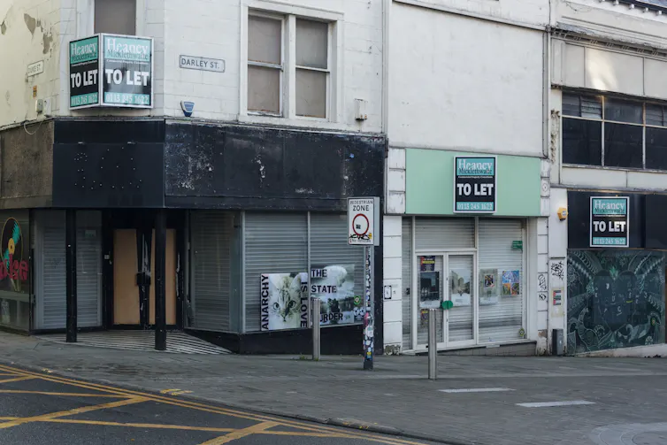 A row of closed shops on a high street in Bradford, Yorkshire.