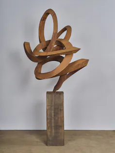 A steel sculpture in a squiggle shape.