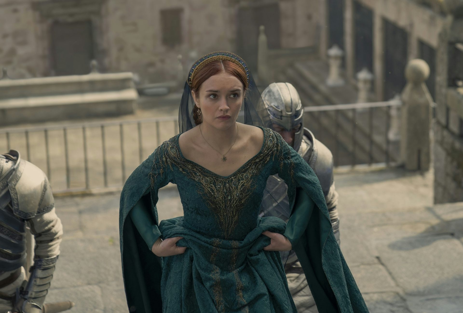 Olivia Cooke walking up stairs in character as Alicent Hightower.