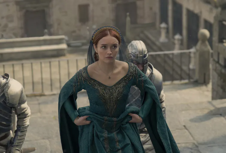 Olivia Cooke walking up stairs in character as Alicent Hightower.
