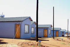 A row of small, blue houses about 40metres squared.