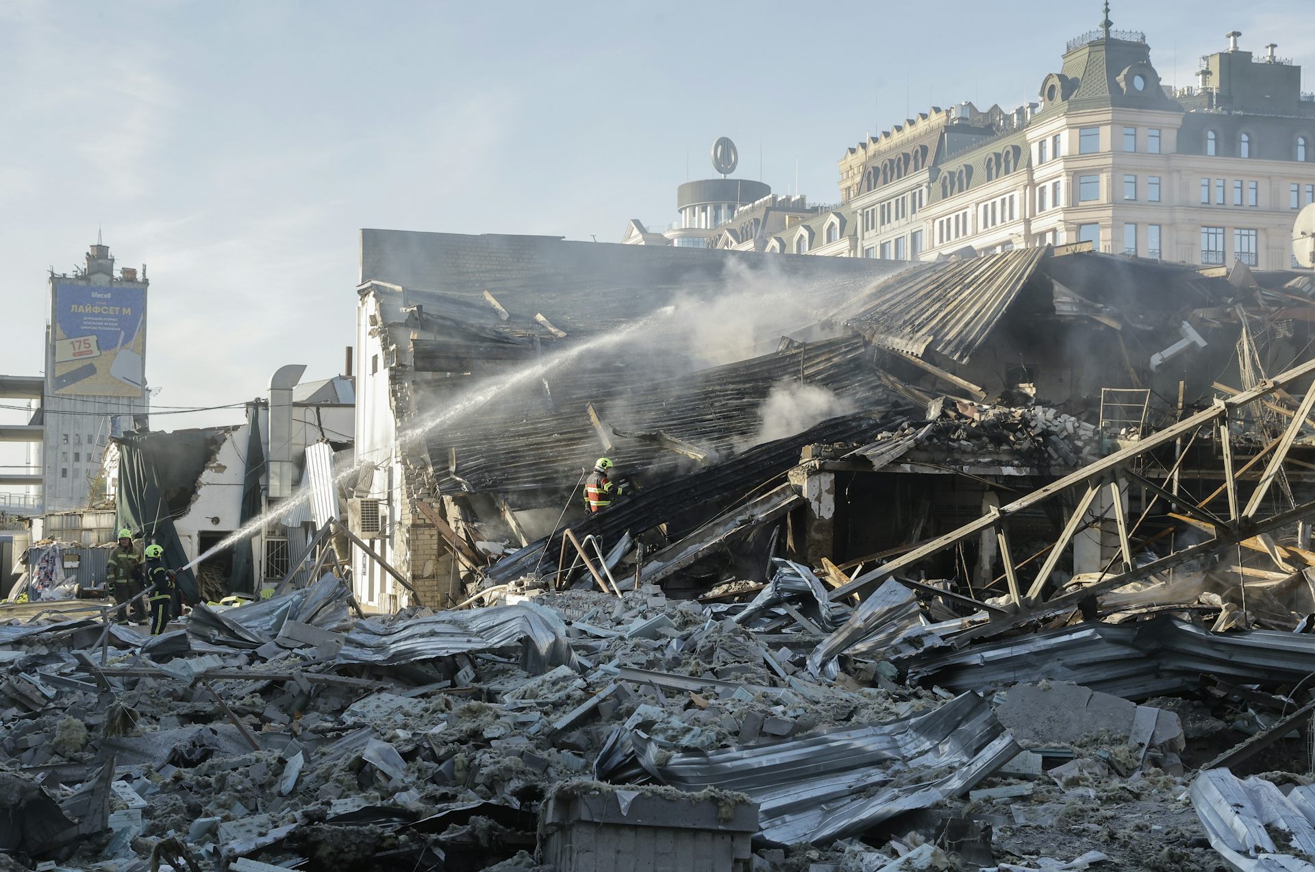 Ukrainian rescuers work at the site of a Russian strike on a car dealership in Kyiv.