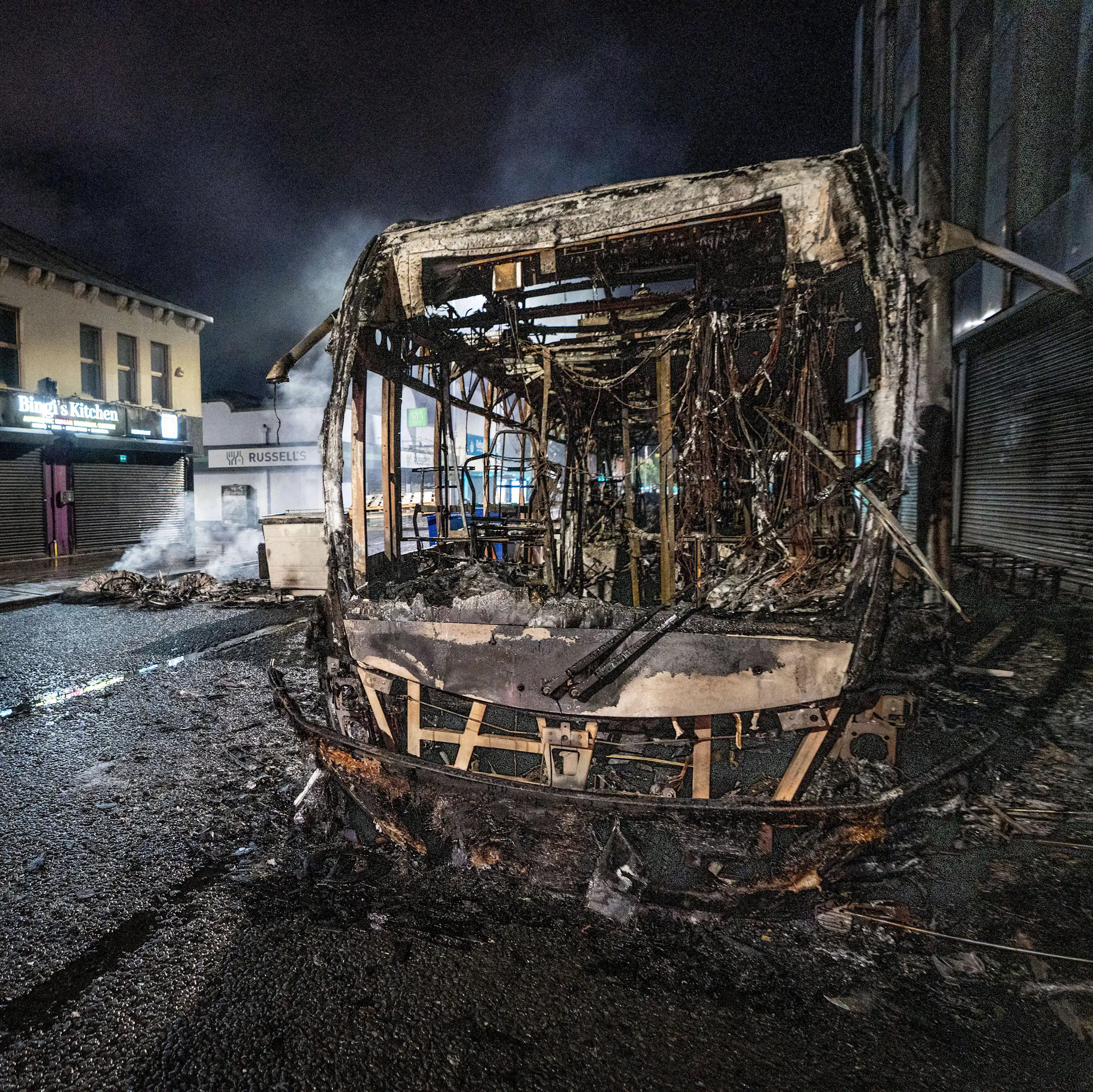 A burnt out bus seen after an anti-immigration protest in Belfast