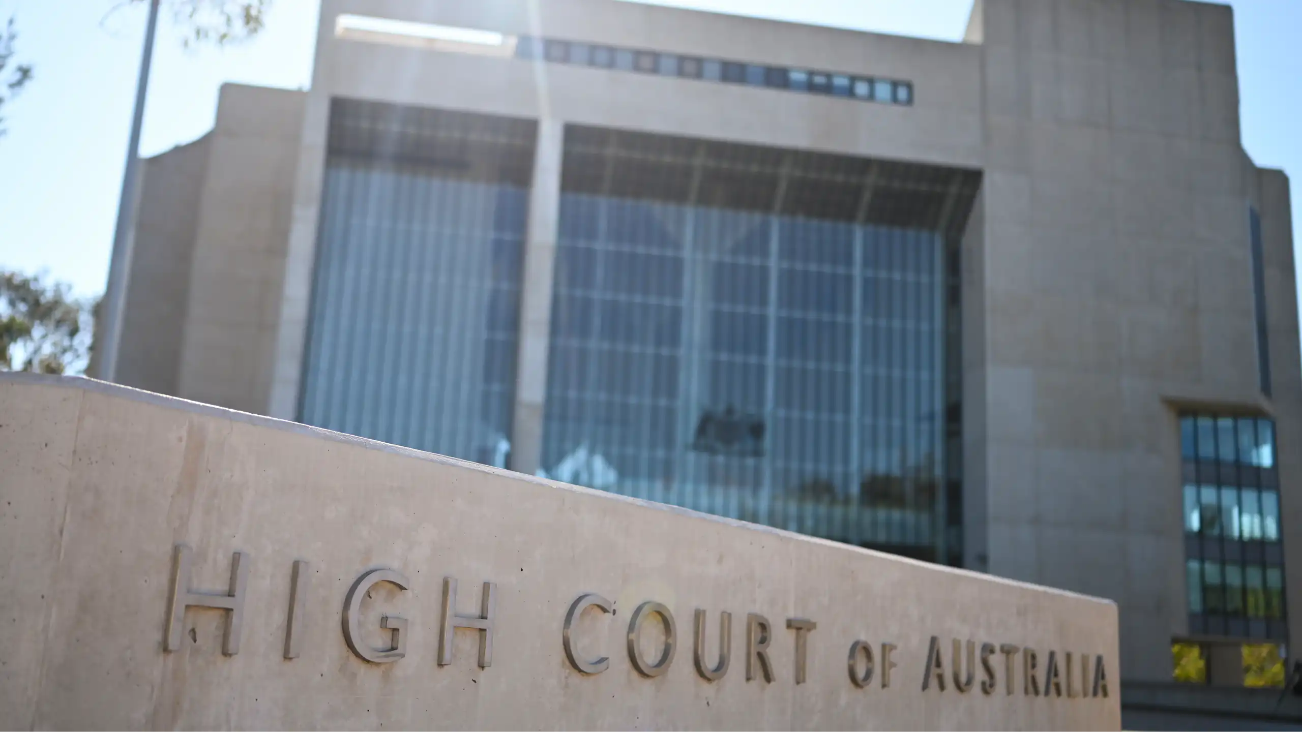 A concretes sign and building saying High Court of Australia