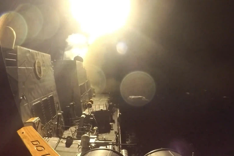 A missile launches from a US military ship