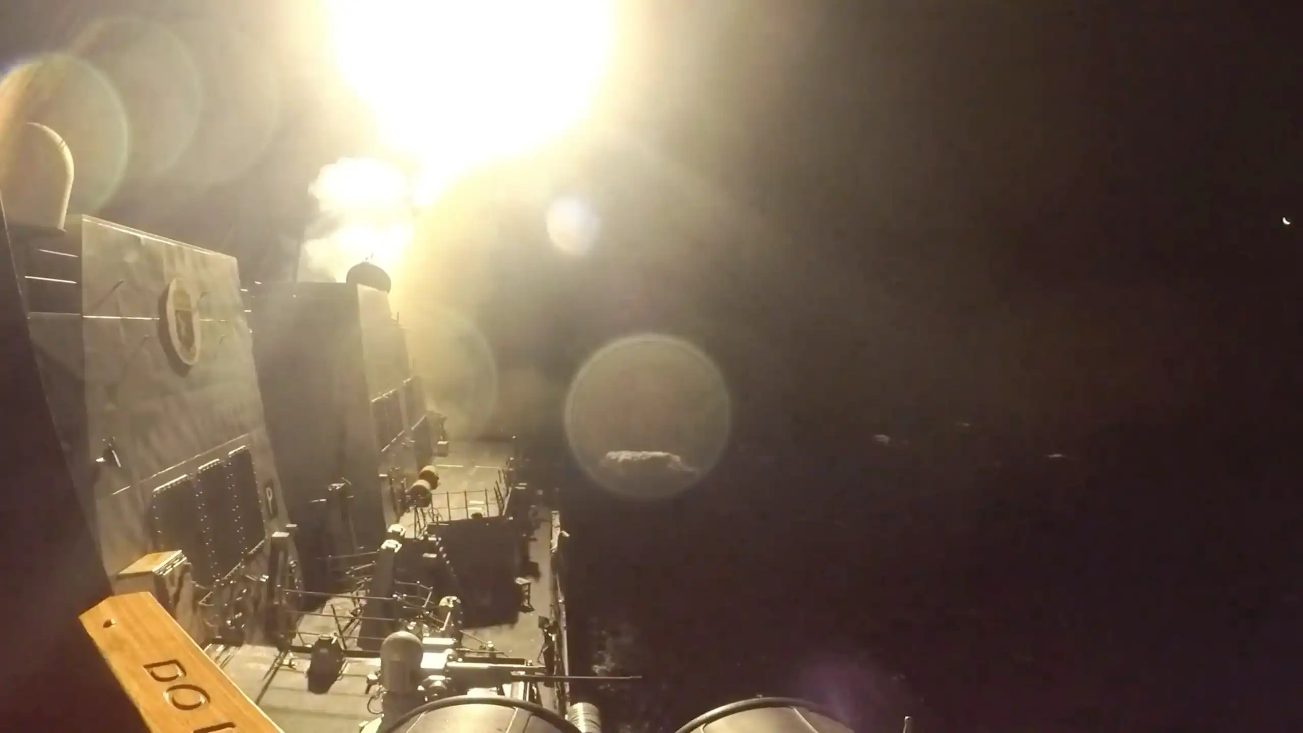 A missile launches from a US military ship