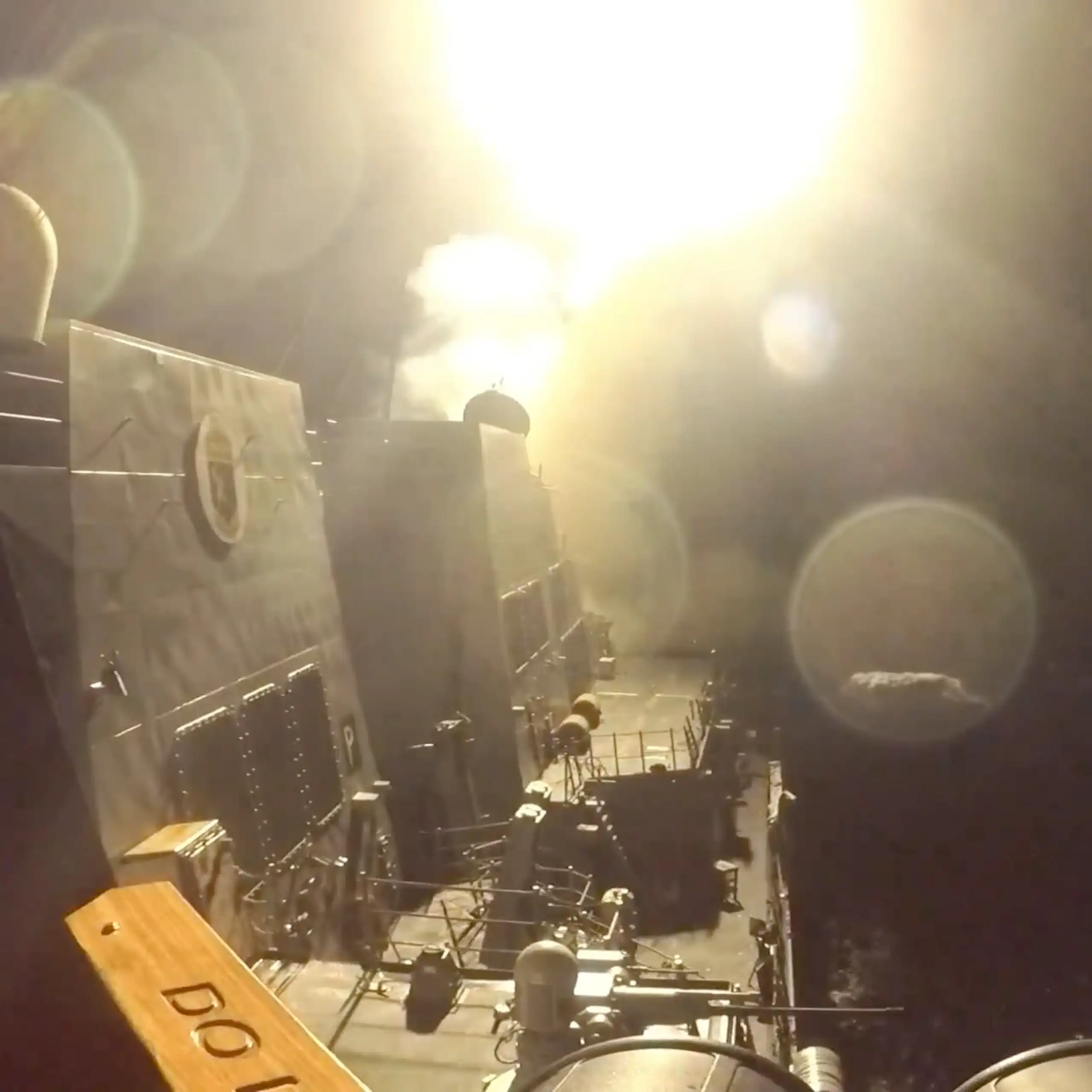 A missile launches from a US military ship