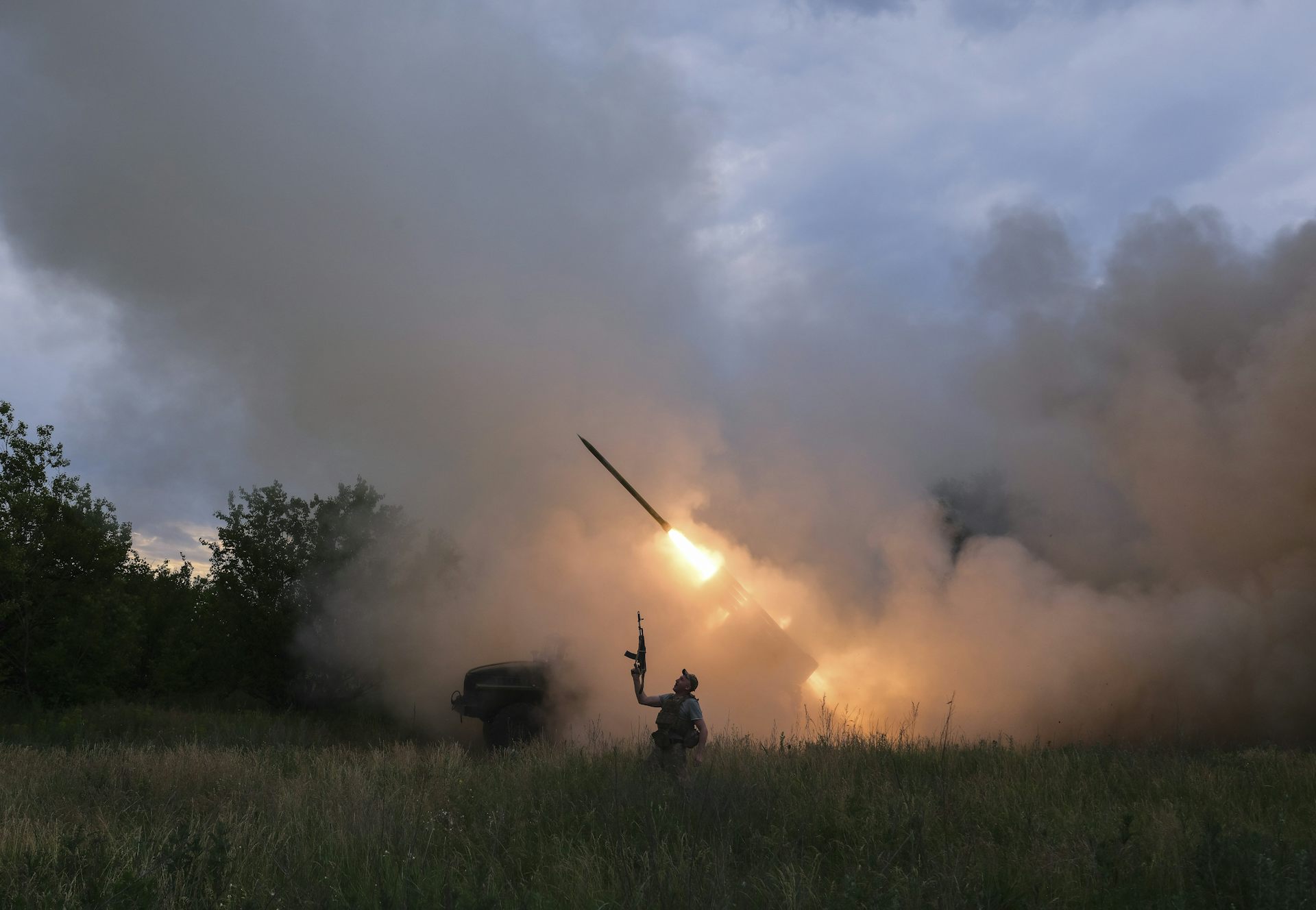 A member of the Ukrainian armed forces fires a rocket towards a Russian position.