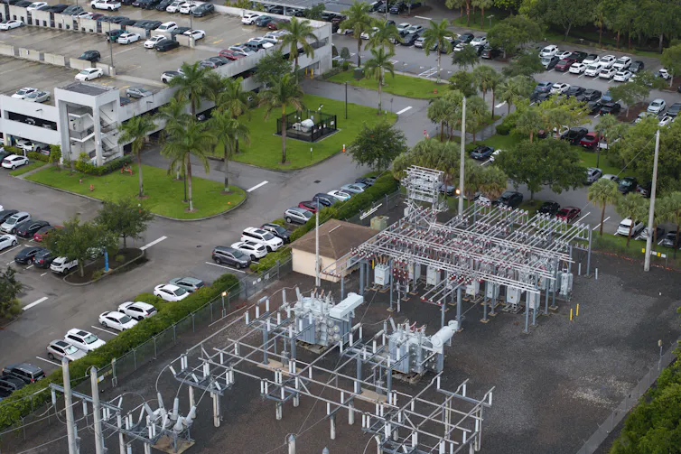 A square area holds wiring and metal equipment.