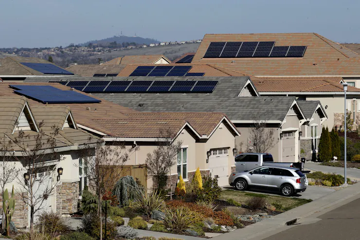 Homes with solar panels on their roofs.