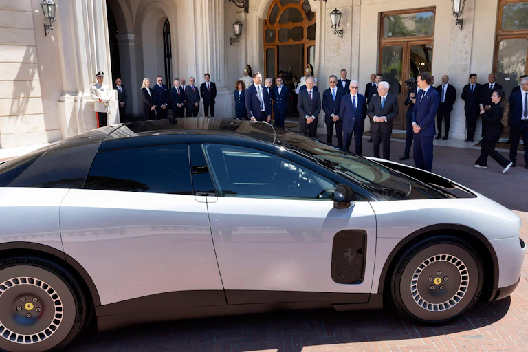 Ferrari's senior executives line up behind the new Luce electric supercar.