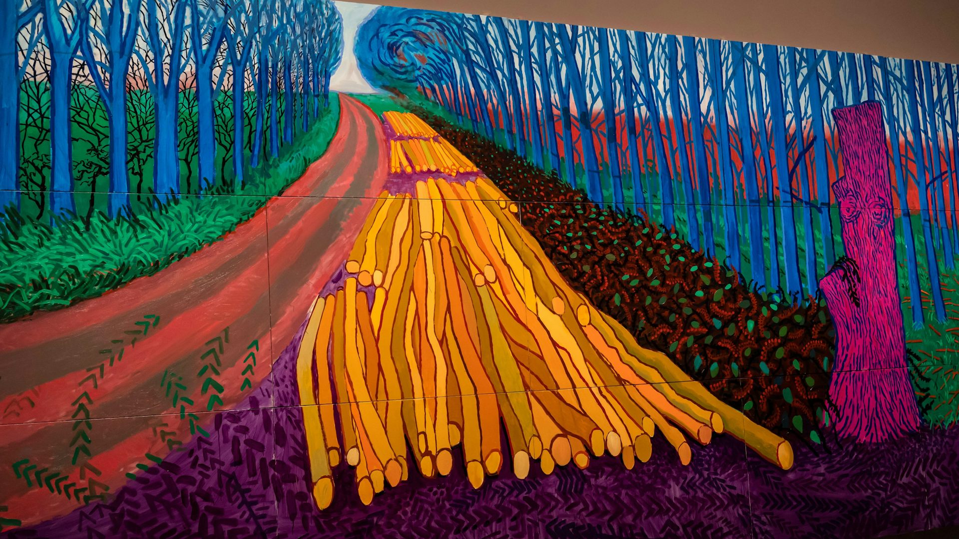 A painting of a rural scene showing a path through some trees in vivid pinks, blues and greens.