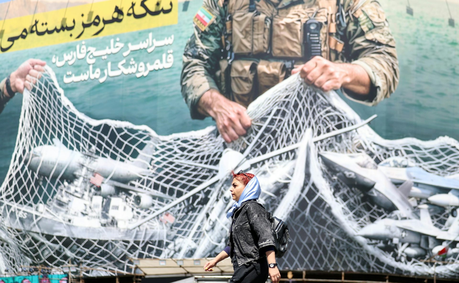 A posted in Tehran showing US aircraft and ships caught in a net on the Strait of Hormuz