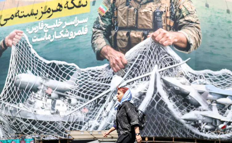 A posted in Tehran showing US aircraft and ships caught in a net on the Strait of Hormuz