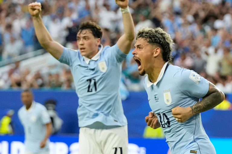 Uruguay's Maxi Araujo celebrates scoring his side's opening goal against Saudi Arabia