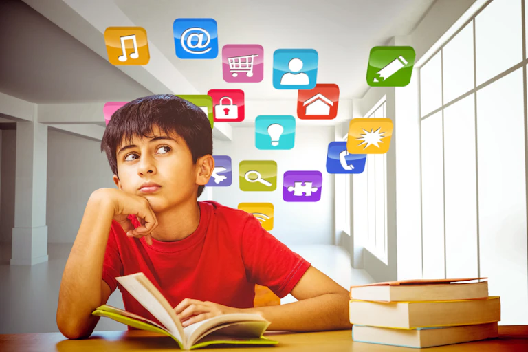 A boy reads a book while surrounded by computing icons.
