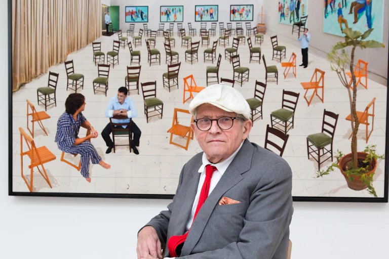 Hockney and a multimedia work of chairs in a gallery.