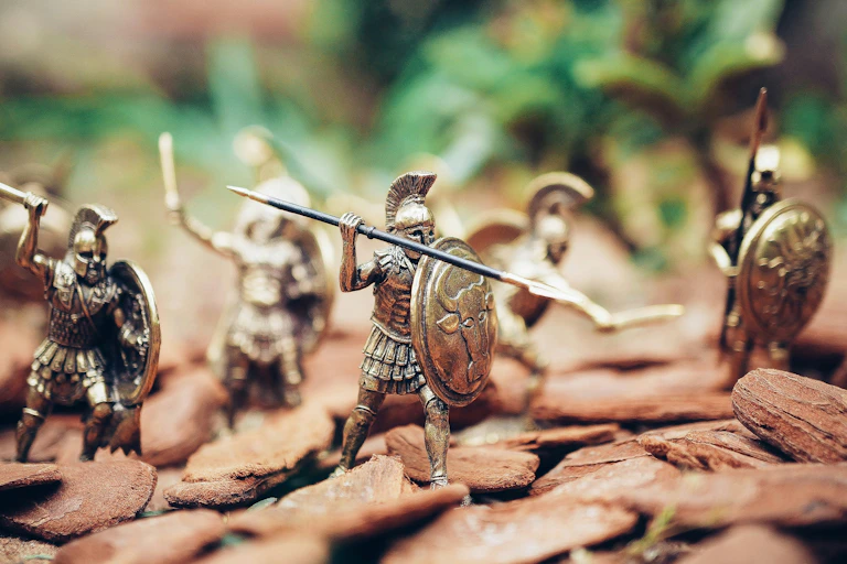 Toy soldiers are arranged on a battle field.