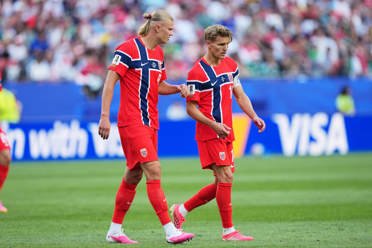 Norway's Erling Haaland, left, and Martin Oedegaard talk during the World Cup Group I soccer match