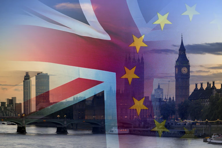 Flags of UK and EU superimposed over London skyline at sunset.