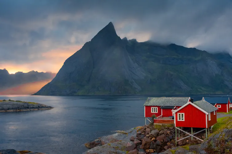 Norwegian landscape with red timber houses.