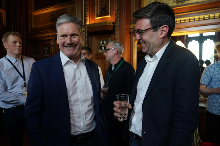 Current UK prime minister Keir Starmer smiling alongside his potential replacement, Andy Burnham, in 2022.