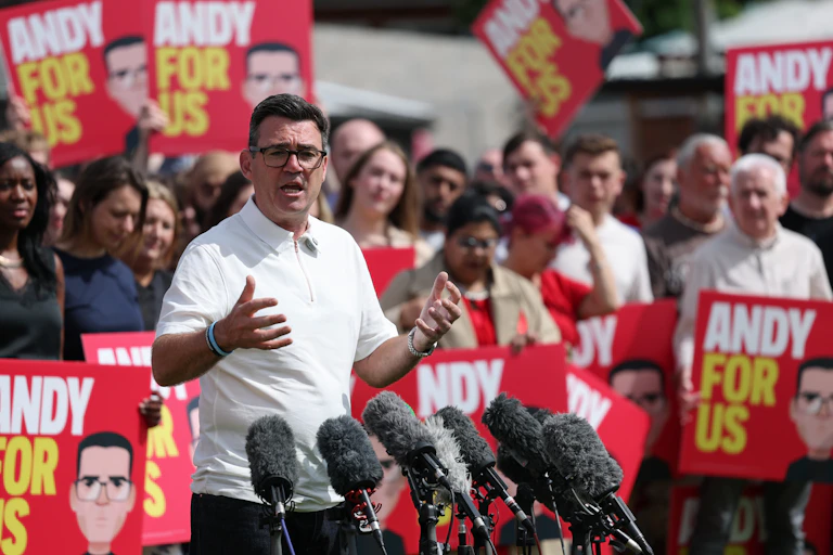 Andy Burnham surrounded by supporters in Makerfield