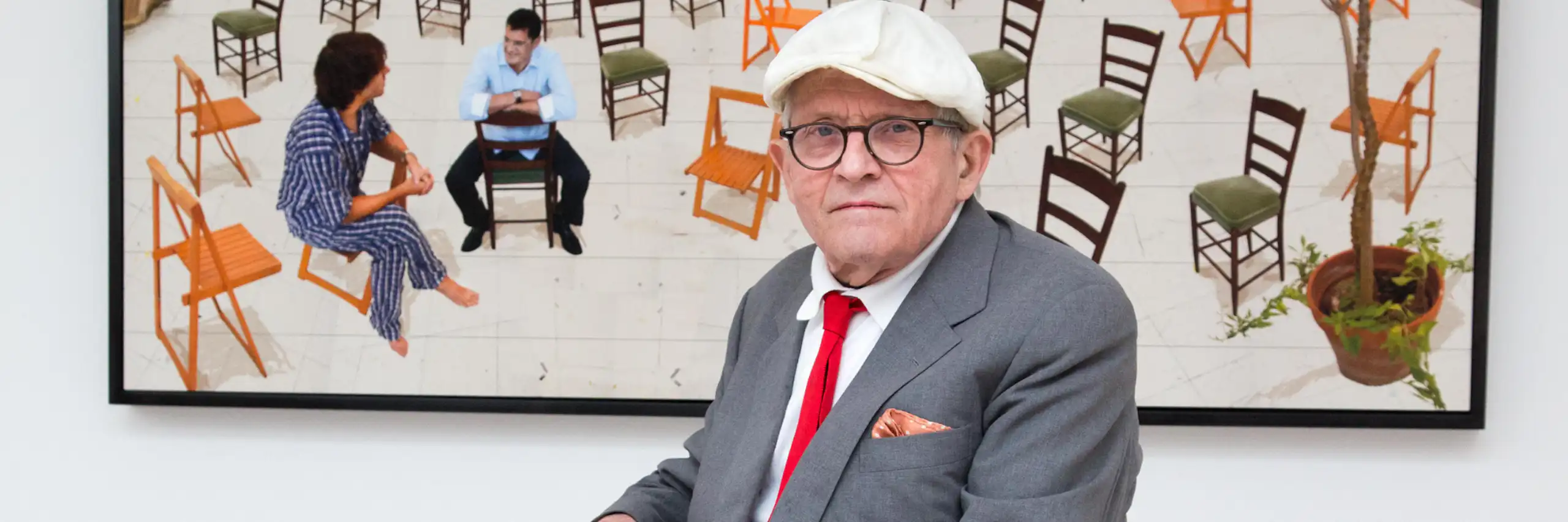 Hockney and a multimedia work of chairs in a gallery.