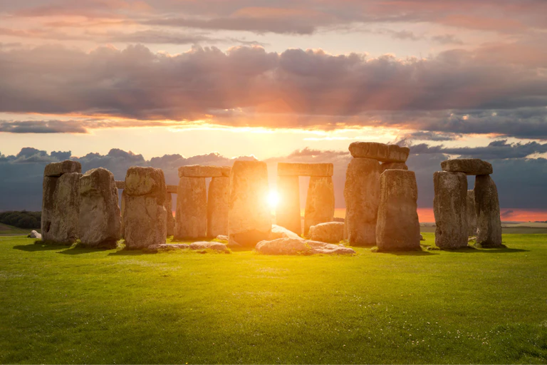 The sun sets over Stonehenge in Wiltshire, southern England.