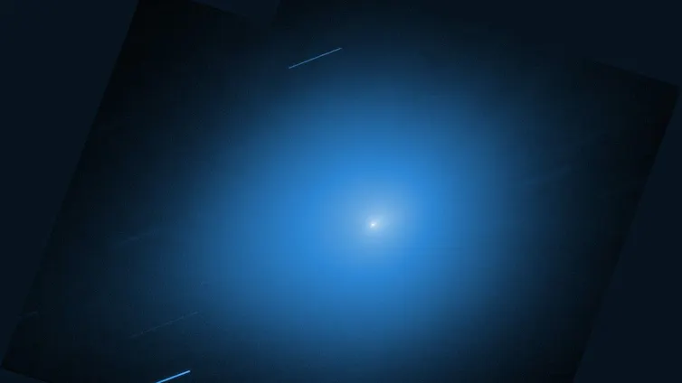 A bright white dot surrounded by a blue glow.