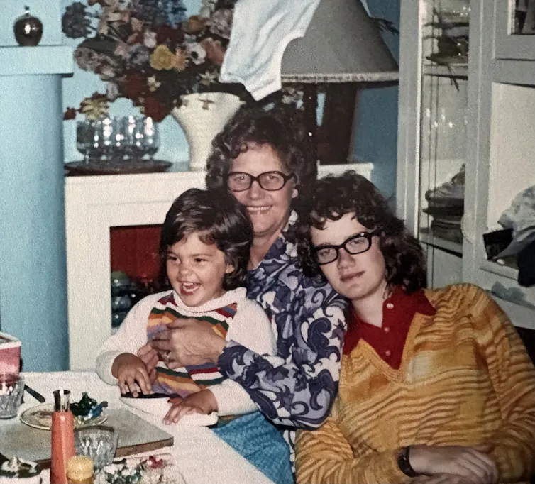 two women and a little girl at a table