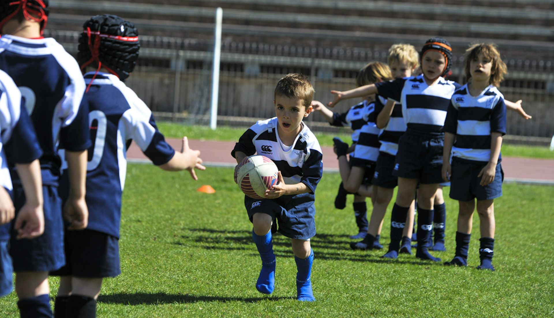 Children playing rugby.
