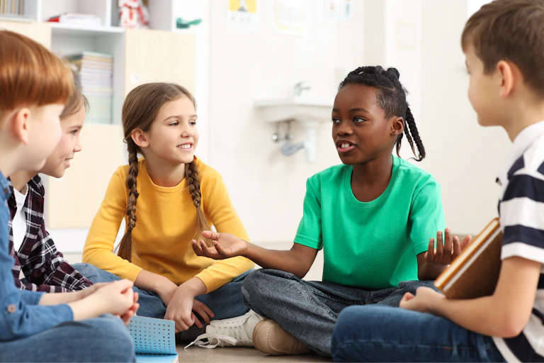 Children sat in a circle talking