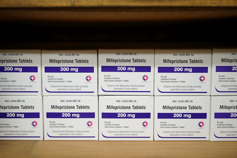 One row of medication boxes is stacked on top of another.