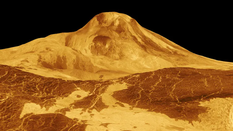 A reconstructed image showing the surface of Venus, with a large volcano in the center.