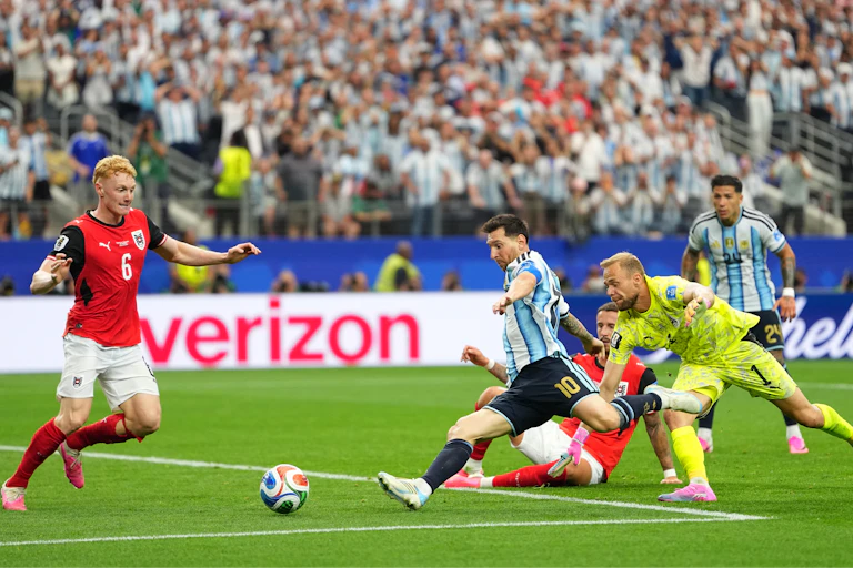 Argentina's Lionel Messi, centre, scores his side's second goal during the World Cup Group J soccer match between Argentina and Austria