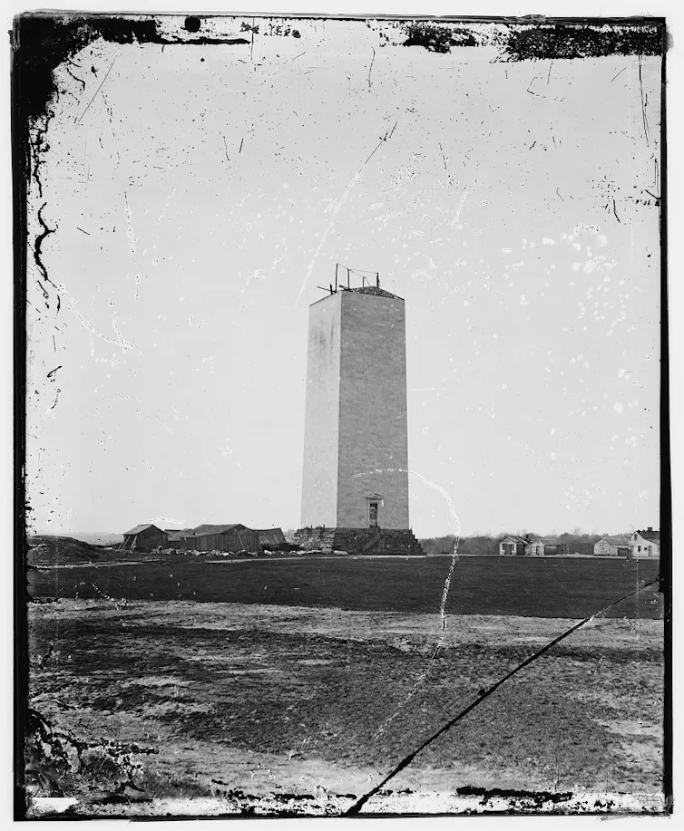 The unfinished stump of a large obelisk during construction.