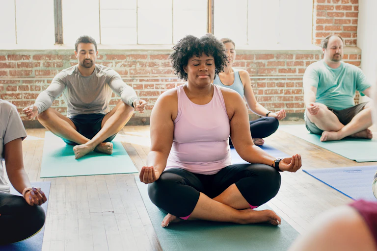 Diverse group of people taking part in a yoga class