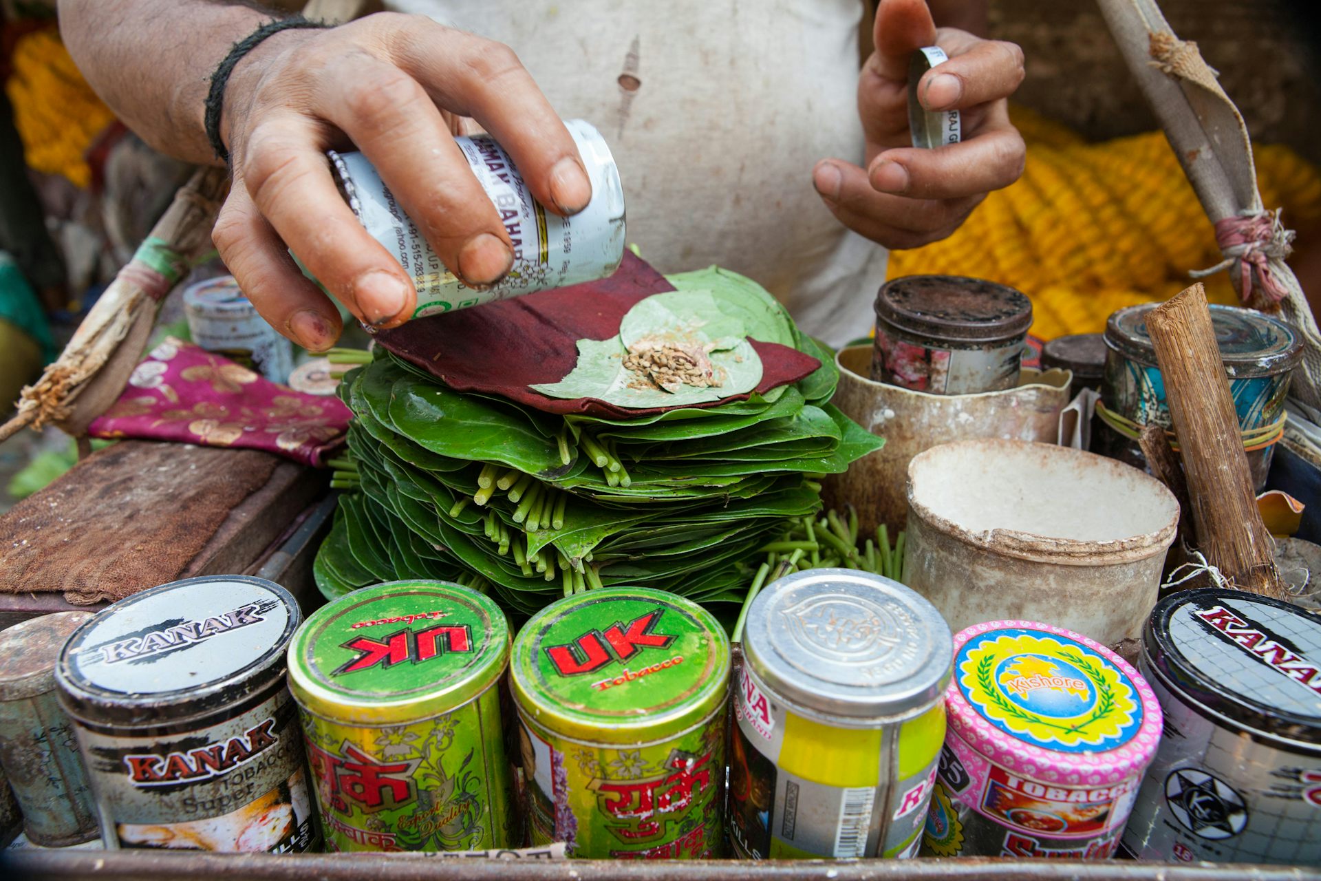 Person making betel quid.
