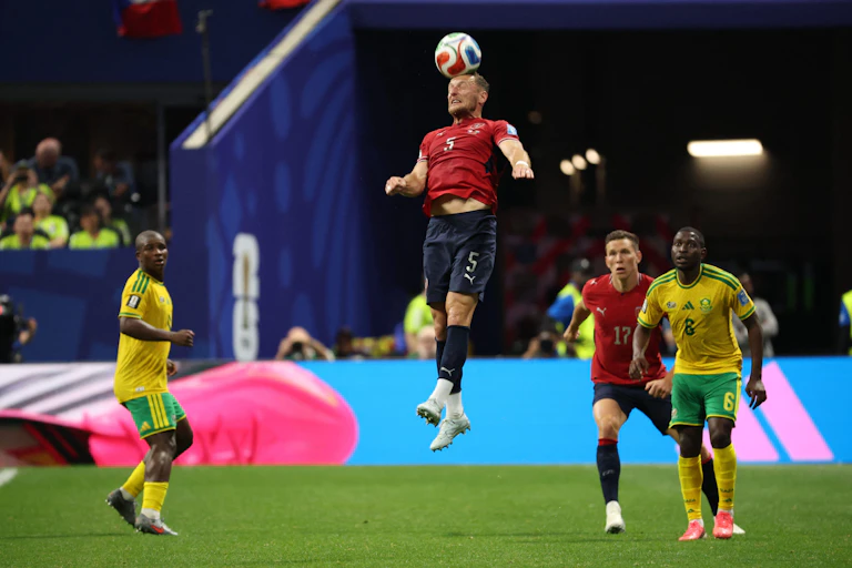 A Czechia player at the Fifa 2026 World Cup heads the ball.