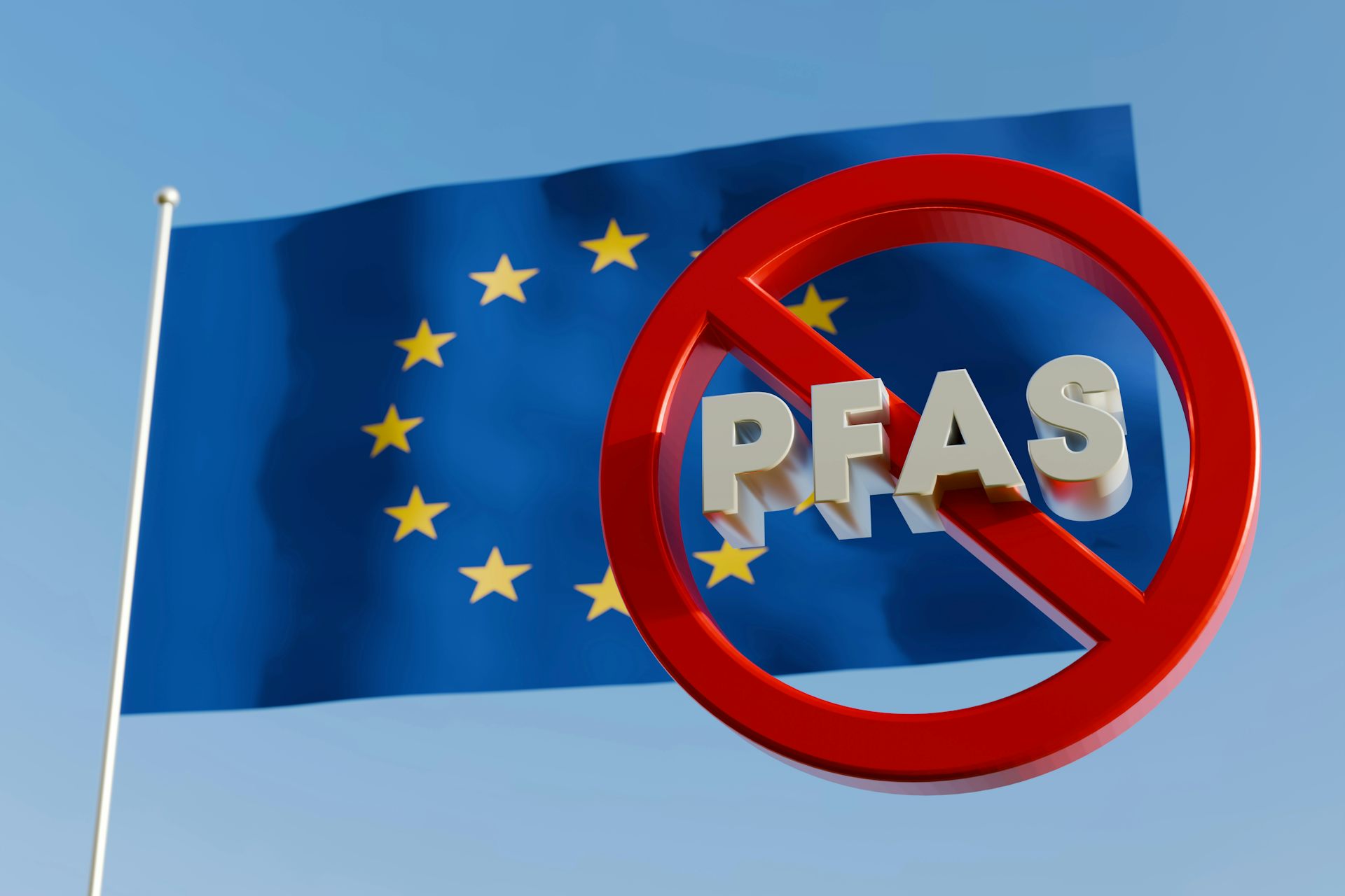 Drapeau de l'Union européenne surmonté d'un panneau d'interdiction où le terme PFAS est barré.
