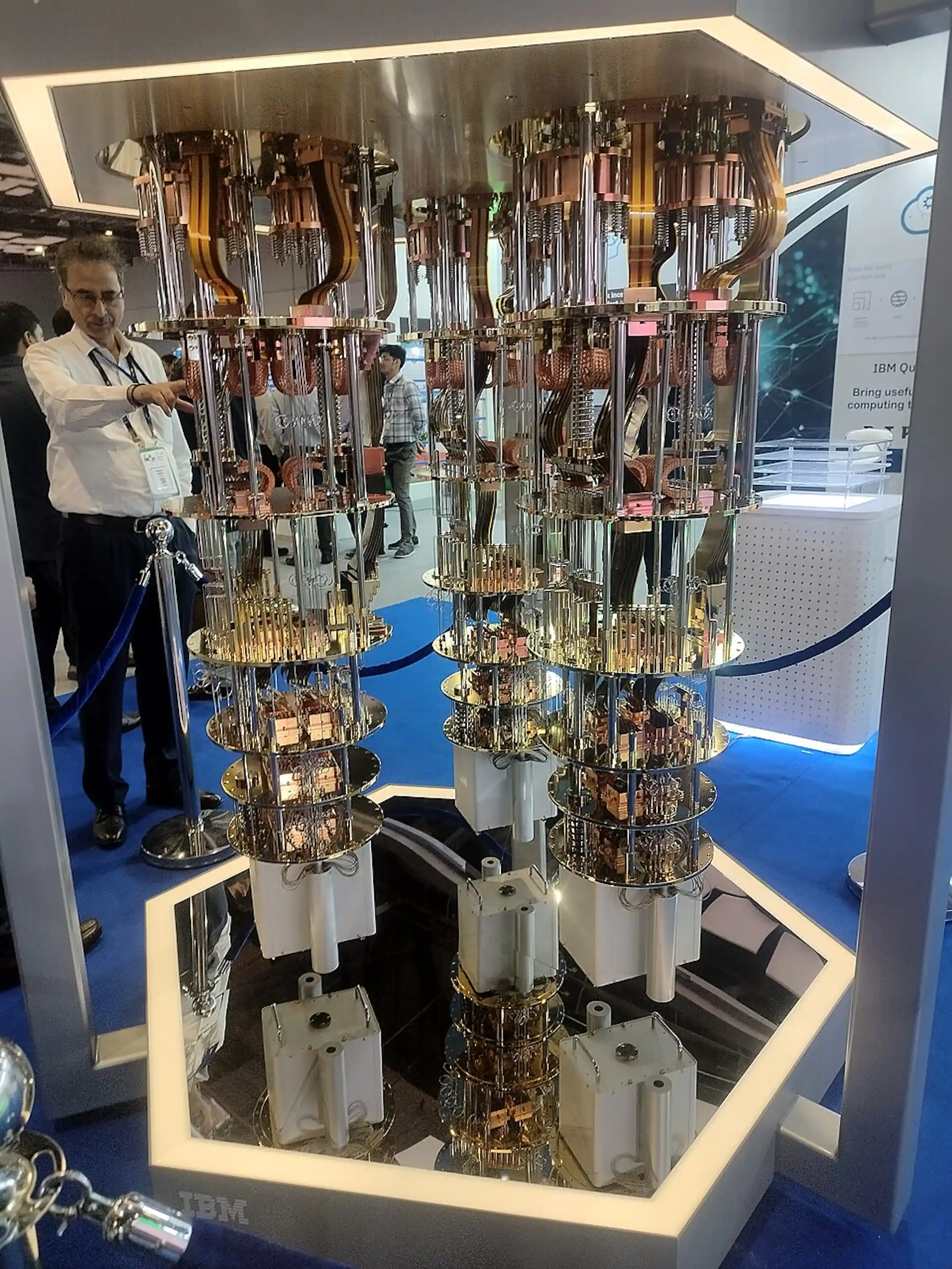 A machine made up of metal disks, rods and electronics, on display in an exhibition hall