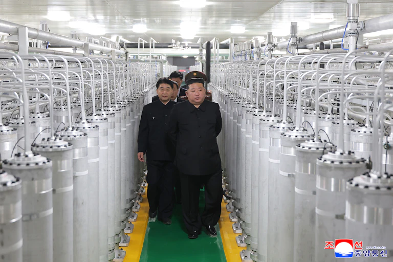 North Korean leader Kim Jong Un (C-R) as he inspects a nuclear materials production factory at an undisclosed location in North Korea